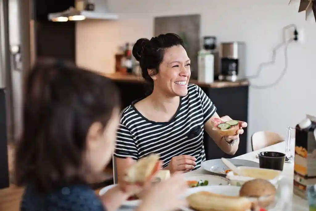 photo of family eating breakfast at table